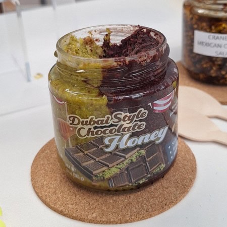 Dubai style chocolate honey with pistachio as a striking premium flavour combination.